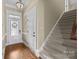 Welcoming foyer with hardwood flooring, staircase and a front door with decorative glass at 335 Wintergreen Ct, Kings Mountain, NC 28086