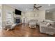 Bright and inviting living room with a stone fireplace, and hardwood floors at 335 Wintergreen Ct, Kings Mountain, NC 28086