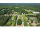 Beautiful aerial view of houses in a neighborhood surrounded by lush greenery and trees at 35 Telephone Exchange Rd, Hickory, NC 28601