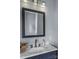 Bathroom with modern vanity, marble countertop, sleek fixtures, a framed mirror, and neutral walls at 35 Telephone Exchange Rd, Hickory, NC 28601