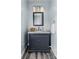 Bathroom with modern vanity, marble countertop, sleek fixtures, a framed mirror, and neutral walls at 35 Telephone Exchange Rd, Hickory, NC 28601