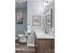 Bathroom featuring vanity, toilet, modern fixtures, clean lines, a neutral color palette, and stylish decor at 35 Telephone Exchange Rd, Hickory, NC 28601