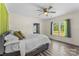 Bedroom featuring hardwood floors, an airy window view, and neutral walls with green drapes at 35 Telephone Exchange Rd, Hickory, NC 28601