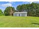 Detached garage with multiple bays and pristine white paint, offering ample space for vehicles and storage at 35 Telephone Exchange Rd, Hickory, NC 28601