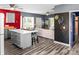 Open-concept living room boasts a large island with seating, hardwood floors, and eye-catching accent walls at 35 Telephone Exchange Rd, Hickory, NC 28601