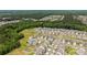 Expansive aerial view of a residential area bordered by lush green trees, offering a serene and picturesque setting at 3643 Slider Ter, Lancaster, SC 29720
