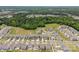 Expansive aerial view of a residential area bordered by lush green trees, offering a serene and picturesque setting at 3643 Slider Ter, Lancaster, SC 29720