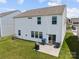 Backyard view of a two-story home, featuring a patio and a green lawn at 3643 Slider Ter, Lancaster, SC 29720