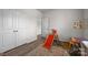 Bright bedroom with a hardwood floor, complemented by a playful slide and a vibrant learning poster at 3643 Slider Ter, Lancaster, SC 29720