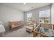 Bright Bedroom featuring two wooden cribs, chair with ottoman, and natural light from two windows at 3643 Slider Ter, Lancaster, SC 29720