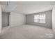 Spacious carpeted bonus room with a window, offering versatile use at 3643 Slider Ter, Lancaster, SC 29720