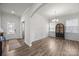 Formal dining room with wainscoting, hardwood floors, and elegant lighting at 3643 Slider Ter, Lancaster, SC 29720