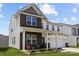 Two-story home featuring a brick and siding exterior, a welcoming front porch, and an attached two-car garage at 3643 Slider Ter, Lancaster, SC 29720