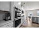 Modern white kitchen with stainless steel appliances and hardwood floors at 3643 Slider Ter, Lancaster, SC 29720