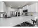 Bright kitchen with white cabinets, stainless steel appliances, and large island with seating at 3643 Slider Ter, Lancaster, SC 29720