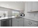 The kitchen features white cabinetry, stainless steel appliances, and a kitchen island at 3643 Slider Ter, Lancaster, SC 29720