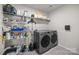 Well-organized laundry room with shelving and modern washer and dryer at 3643 Slider Ter, Lancaster, SC 29720