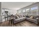 Inviting living room with a large sofa and hardwood floors, open to the kitchen at 3643 Slider Ter, Lancaster, SC 29720