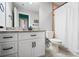 Bathroom with white cabinets, granite counters, and shower with bathtub combination at 3707 Seagrave Farm Rd, Concord, NC 28025