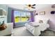 Comfortable bedroom with large window, soft carpet, and decor at 3707 Seagrave Farm Rd, Concord, NC 28025