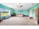 Large bonus room with 'PLAY' decor, a comfortable couch, and an abundance of natural light at 3707 Seagrave Farm Rd, Concord, NC 28025