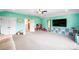 Spacious bonus room with large TV, ceiling fan, and ample space for recreation and entertainment at 3707 Seagrave Farm Rd, Concord, NC 28025