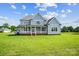Beautiful two-story home with a large green lawn enhancing curb appeal at 3707 Seagrave Farm Rd, Concord, NC 28025