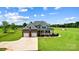 Beautiful exterior featuring a well-maintained lawn, two-car garage, and inviting front porch at 3707 Seagrave Farm Rd, Concord, NC 28025