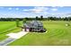 Stunning aerial view of a home with a large yard, two-car garage, and covered front porch at 3707 Seagrave Farm Rd, Concord, NC 28025