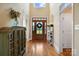 Grand foyer with hardwood floors, a high ceiling, and a decorative wooden door at 3707 Seagrave Farm Rd, Concord, NC 28025