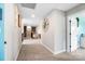 Inviting hallway with carpet flooring and neutral walls, leading to other areas of the home at 3707 Seagrave Farm Rd, Concord, NC 28025
