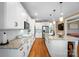 Spacious kitchen featuring marble countertops, white cabinets, and stainless steel appliances at 3707 Seagrave Farm Rd, Concord, NC 28025