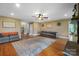 Cozy living room with hardwood floors, neutral decor, and comfortable seating area at 3707 Seagrave Farm Rd, Concord, NC 28025