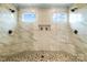 Luxurious marble shower with dual shower heads, tile accents, and natural light at 3707 Seagrave Farm Rd, Concord, NC 28025