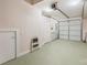 Spacious basement featuring a garage door, laundry area, and ample storage space at 415 W 7Th St # F, Charlotte, NC 28202