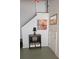 Basement nook with black storage shelves and staircase with decorative wall art at 415 W 7Th St # F, Charlotte, NC 28202