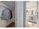Bathroom with a vanity and framed mirror, tile floors, and a peek at the walk-in closet at 415 W 7Th St # F, Charlotte, NC 28202