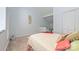 Cozy bedroom with neutral carpet, white walls and a decorative painting at 415 W 7Th St # F, Charlotte, NC 28202