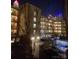 Exterior view of the building's lighting, surrounded by city lights at night at 415 W 7Th St # F, Charlotte, NC 28202