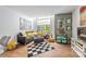 Living room featuring hardwood floors, large window, comfortable couch and stylish decor at 415 W 7Th St # F, Charlotte, NC 28202