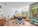 Comfortable living room area with stylish furniture, natural light and a modern aesthetic at 415 W 7Th St # F, Charlotte, NC 28202