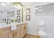 Charming bathroom features double sinks, a large mirror, and natural-looking wood vanity at 4566 Fork Rd, Norwood, NC 28128