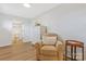 Comfortable bedroom features an upholstered arm chair, tall dresser, and access to an ensuite bathroom at 4566 Fork Rd, Norwood, NC 28128