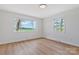 Bright bedroom with hardwood floors and large windows offering scenic views of the outdoors at 4566 Fork Rd, Norwood, NC 28128