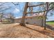 Rear exterior view showcasing the house, yard, and carport at 4566 Fork Rd, Norwood, NC 28128