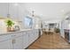 Open kitchen area features stainless steel appliances, quartz countertops, and a view into the living room at 4566 Fork Rd, Norwood, NC 28128