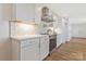Bright kitchen features modern appliances, quartz countertops, and white cabinets with beautiful backsplash at 4566 Fork Rd, Norwood, NC 28128