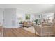 Bright and open living room featuring hardwood floors and neutral decor at 4566 Fork Rd, Norwood, NC 28128