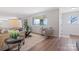 Open living room with an area rug, and a clear view into an eat-in kitchen at 4566 Fork Rd, Norwood, NC 28128