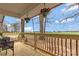 View from the porch showing open space with new wood flooring and railings at 4566 Fork Rd, Norwood, NC 28128